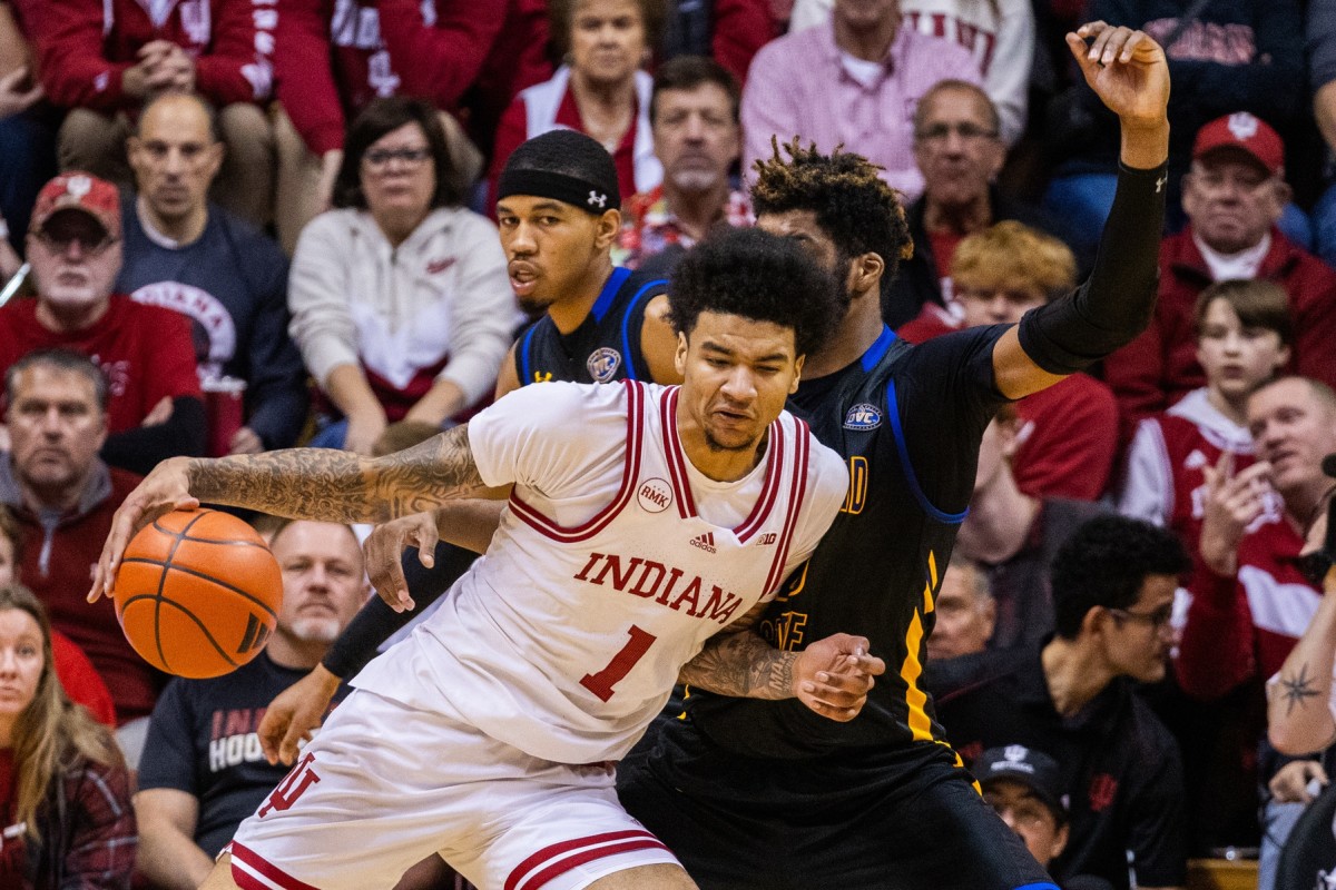 Dec 19, 2023; Bloomington, Indiana, USA; Indiana Hoosiers center Kel'el Ware (1) dribbles the ball while Morehead State Eagles forward Dieonte Miles (23) defends in the second half at Simon Skjodt Assembly Hall. Mandatory Credit: Trevor Ruszkowski-USA TODAY Sports
